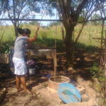 Drawing water from the original well in Cuadrante 81